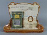 a ceramic figurine of a bathroom with a toilet and sink