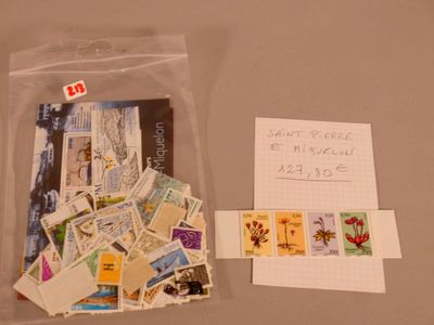 a bag of stamps and a note on a table
