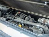 the engine compartment of a car with its hood open