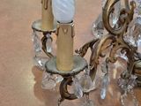 two candles that are sitting on a table in a room