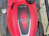 a lawn mower that is sitting on the ground