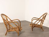 pair of rattan lounge chairs in the style of hans wegnel