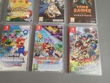 several nintendo wii games are lined up on a table