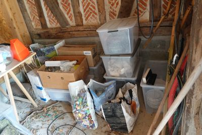 a pile of boxes and other items in a room