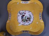 a yellow plate with a picture of a bird on it