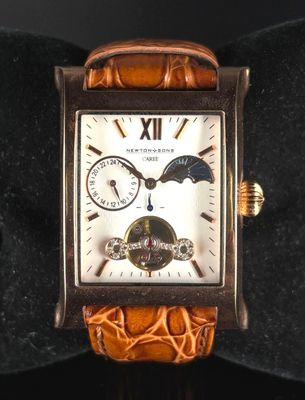 an image of a close up of a wrist watch with a brown leather band