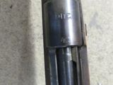 an image of a close up of a gun that is on the ground