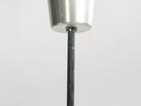a metal cup on a metal pole with a handle