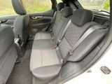 the back seats of a car are empty and the seats are empty