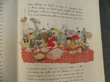 an open book with a picture of a bunch of animals on it