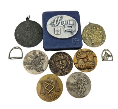 some coins are sitting on top of a blue case