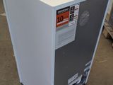an image of a white refrigerator in a warehouse