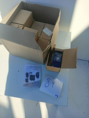 a box with a cell phone inside of it on a table