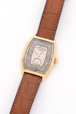 an image of a wrist watch with a brown leather strap