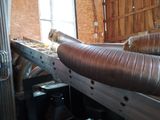 a large pipe sticking out of the side of a building
