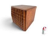 a small wooden box with a book on top of it