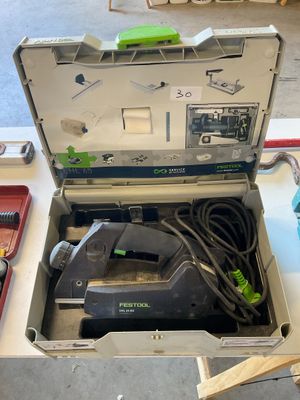 a box with a tool in it sitting on a table