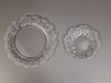two glass plates that are sitting on a table