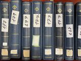many books that are on a book shelf together