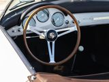 a steering wheel and dashboard of a car with a bag on it