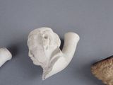 three pieces of art that are on a table