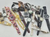 a lot of watches that are sitting together on a table