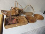 many baskets on a table with a white table cloth