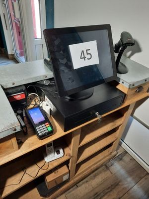 a laptop computer sitting on top of a wooden desk