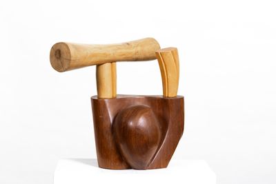 a wooden chair with a wooden handle on top of it