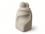 a stone sculpture of a man and a woman on a white background