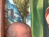 portrait of a man and a woman looking at a painting of a man and a woman
