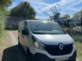 the white van is parked on the side of the road