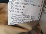 a close up of a label on a jacket showing the size of the jacket