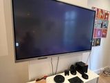 a flat screen tv mounted on a wall in a room