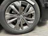 a close up of a car tire with a sticker on it