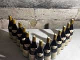 several bottles of wine are arranged in a heart shape on a table