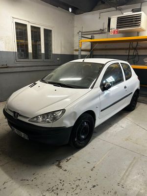 a small white car parked in a garage