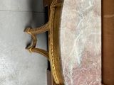 a marble table with a mirror on top of it