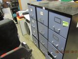 a picture of a file cabinet and a chair in a room