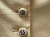 an image of a close up of a jacket with buttons