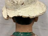 a statue of a man with a hat on his head