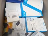 a cardboard box full of electronic devices in it