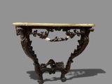 an antique console table with a marble top on a gray background