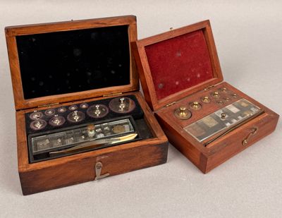 two wooden boxes that have a clock inside of them
