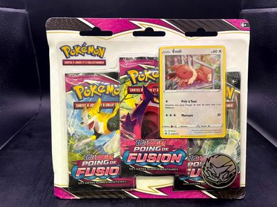 a close up of a box of pokemon cards on a couch