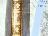 an old book on a table with a price tag on it