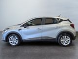 the silver car is parked in the room on the concrete floor