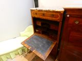 a small desk with a chalk board in it