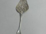 a close up of a spoon on a table with a white background