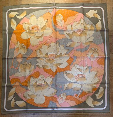 an image of a square scarf with flowers on it on a wooden floor
